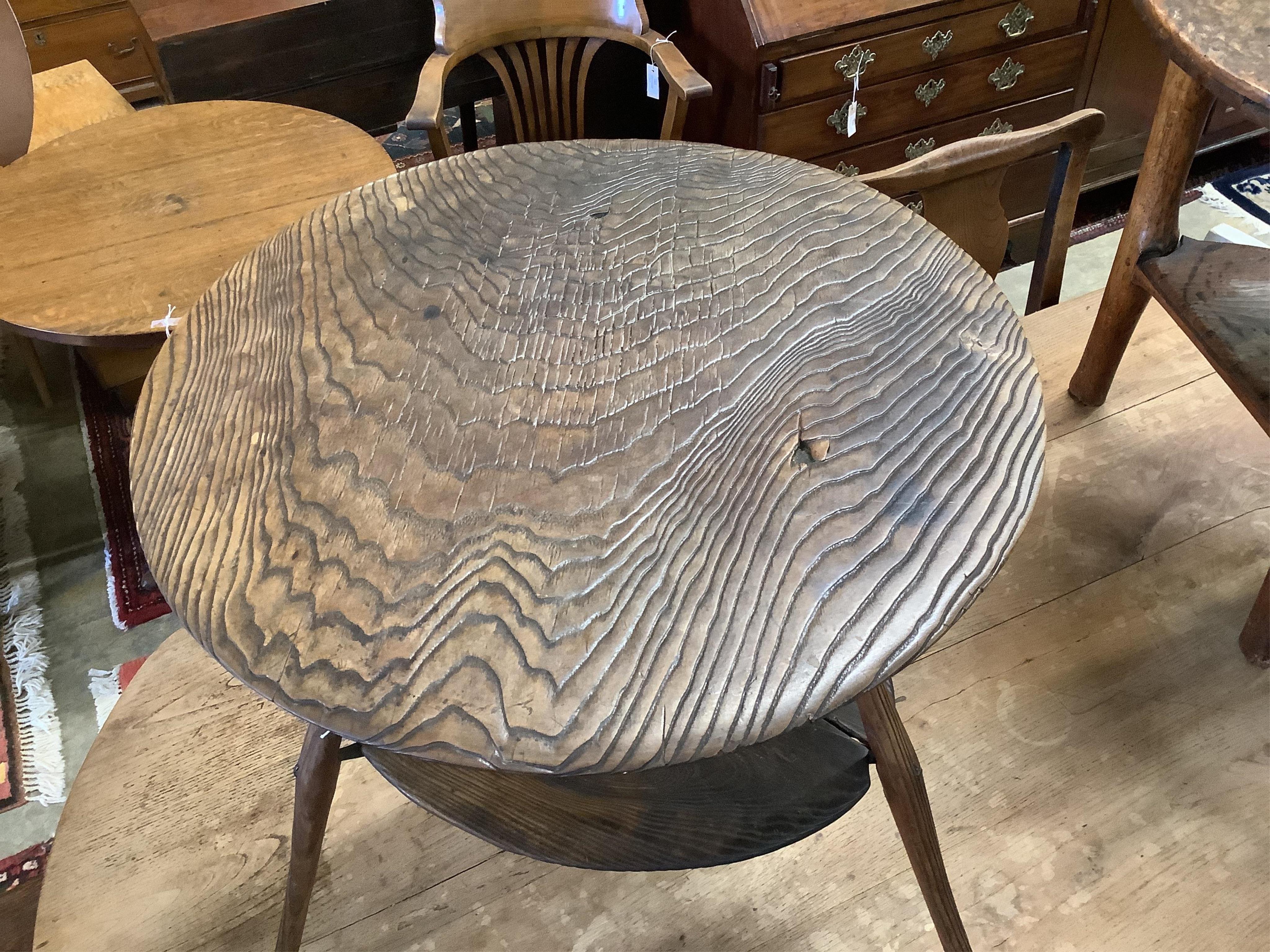 An unusual 18th century weathered elm cricket table, width 61cm, height 60cm. Condition - fair to good